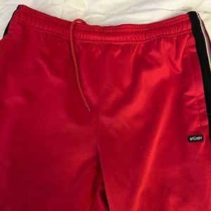 Red Stussy sweatpants